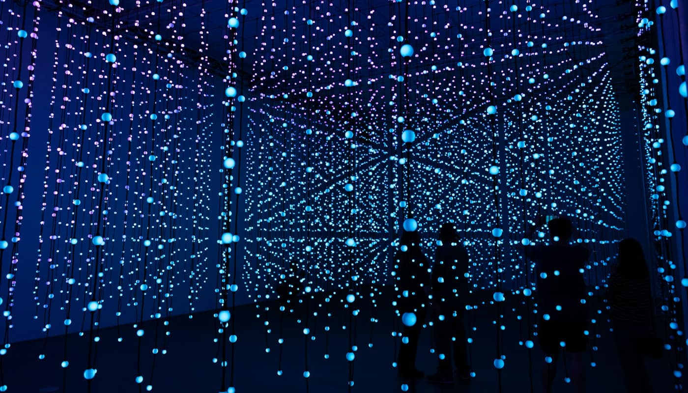 Rows of tiny blue lights forming a grid in a dark room